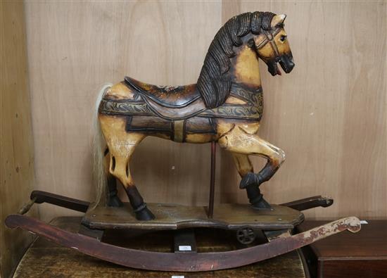 A Toy horse mounted on rockers Height 85cm.